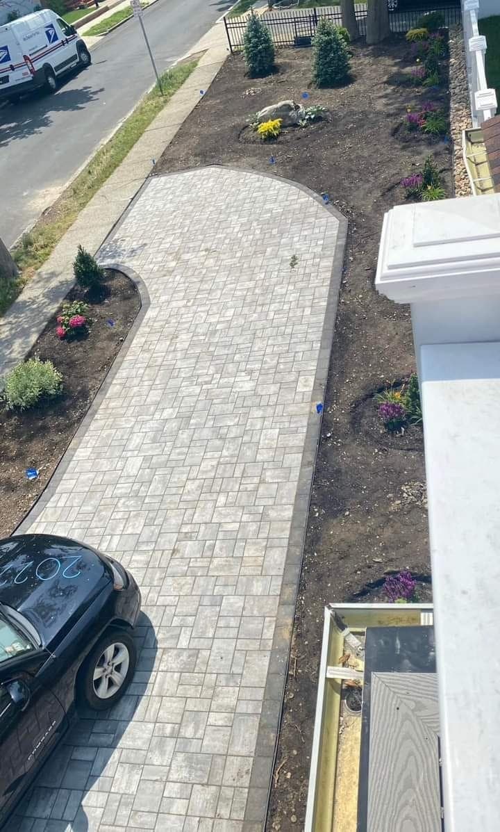 Newly-installed paver walkway adjacent to a town sidewalk